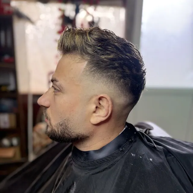 A textured top with a skin fade