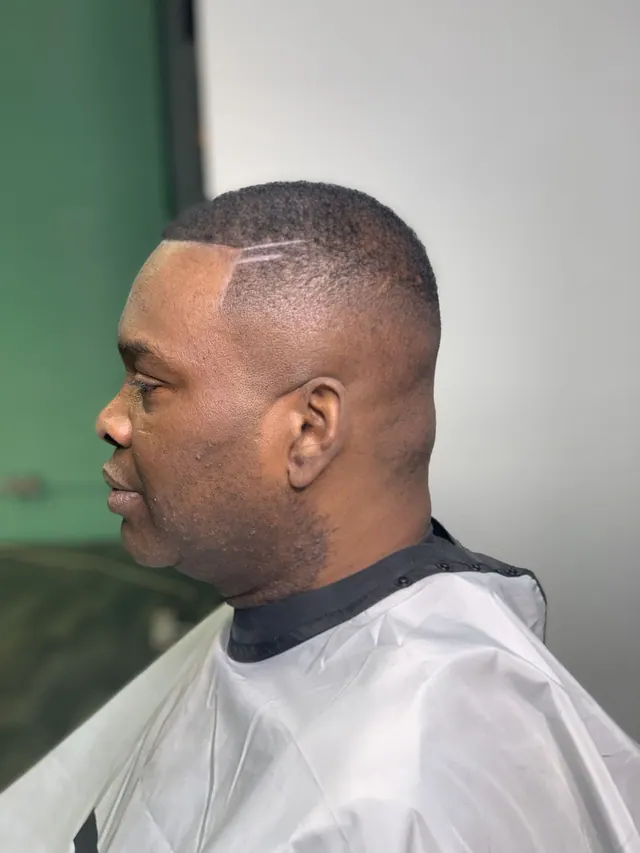 A buzz cut with a part